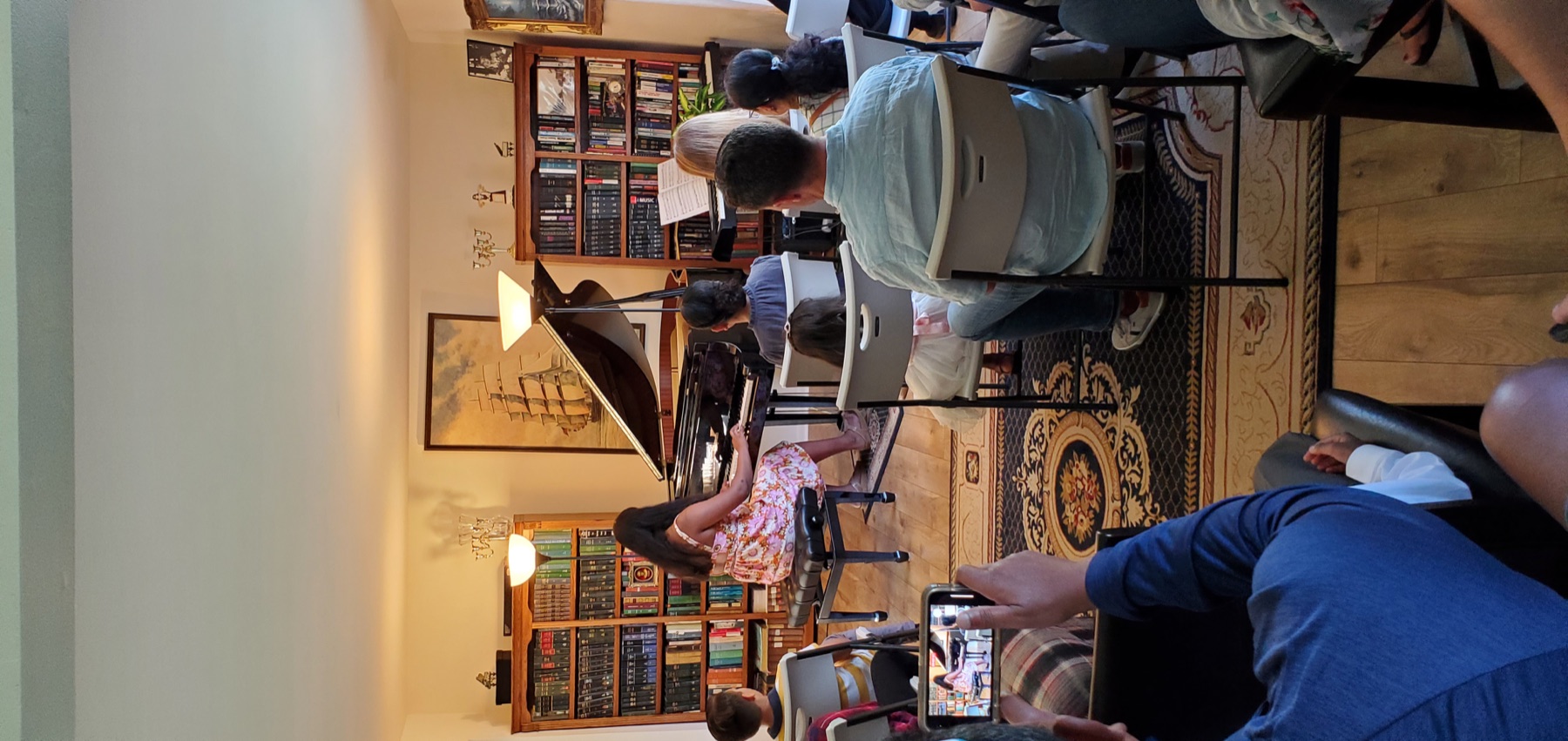 Student performing at the grand piano during a concert