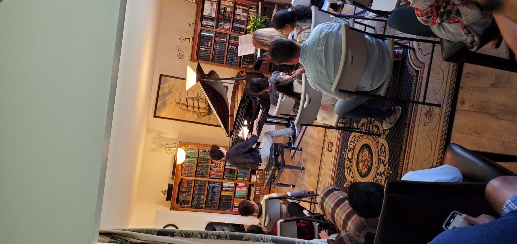Young pianist performing at a student recital